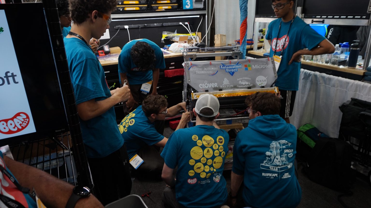 Team BEAN students and robot at competition